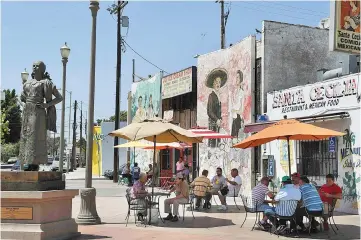  ??  ?? Murals painted at the newly renovated Mariachi Plaza in Boyle Heights, California. Trendy cafés and art galeries are the scene of hostile tags, protests, online harassment in Boyle Heights, which is a hispanic and low income neighborho­od of Los Angeles...