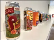  ?? COURTESY OF CAC ?? These uniquely designed beer cans are among art pieces on display in “The Art of Beer” exhibition at Community Arts Center through May 10.