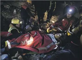  ?? Tom Nicholson For The Times ?? THE L.A. COUNTY Fire Department Urban Search and Rescue team works with Turkish crews to remove a girl trapped for days in Adiyaman, Turkey.