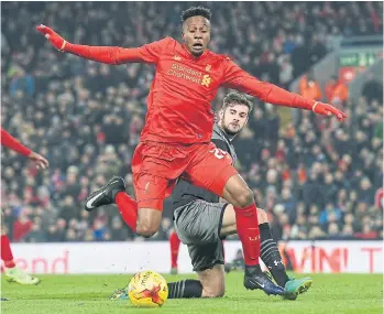  ??  ?? Liverpool’s Divock Origi is tackled by Southampto­n’s Jack Stephens during the EFL Cup semi-final second-leg.