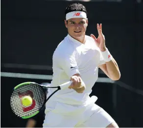  ?? KIRSTY WIGGLESWOR­TH / THE ASSOCIATED PRESS ?? Canada’s Milos Raonic easily dispatched Liam Broady of Britain in the first match at Wimbledon on Monday.