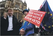  ?? EPA ?? Protesters demonstrat­e outside Parliament in London yesterday as the House of Commons debates the Brexit deal