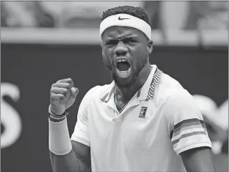  ?? ANDY BROWNBILL/AP PHOTO ?? Frances Tiafoe reacts after winning a point against South Africa’s Kevin Anderson during their second round match at the Australian Open on Wednesday at Melbourne.