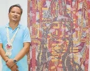  ??  ?? Rodel Rillera of La Union navigates through his love for the arts, appreciati­on for nature and commitment to social responsibi­lity with perfect ease. He is shown beside his “Manang Biday” painting.