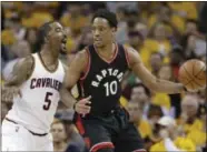  ?? TONY DEJAK — THE ASSOCIATED PRESS ?? The harassing defense of the Cavaliers’ J.R. Smith has limited Raptors’ All-Star DeMar DeRozan so far in the series.