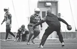  ??  ?? Left: Cardinals cornerback David Amerson, center, was released on Thursday.