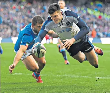  ??  ?? Flying Scot: Blair Kinghorn scores the second of his three tries against Italy. Next Saturday he will get his chance at full-back