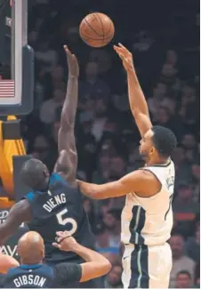  ?? John Leyba, The Denver Post ?? Nuggets forward Trey Lyles, taking a shot over Minnesota Timberwolv­es center Gorgui Dieng this season, says his confidence is at “an all-time high.”