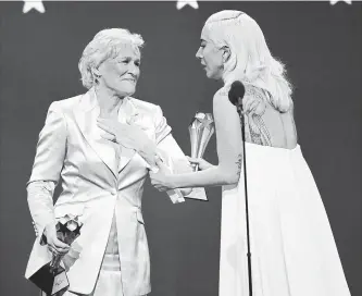  ?? CHRIS PIZZELLO THE ASSOCIATED PRESS ?? Glenn Close, left, and Lady Gaga react after winning the awards for best actress in a tie at the 24th annual Critics' Choice Awards. Close won for her role in "The Wife" and Lady Gaga won for her role in "A Star Is Born."