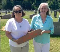  ?? Submitted photo ?? ■ Author Bitty Martin and childhood friend Leslie (Tracy) Swinford visit Cathie Ward’s Murfreesbo­ro grave in 2018.