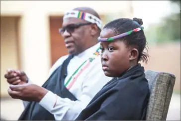  ?? MUJAHID SAFODIEN/AFP ?? Masalanabo Modjadji, 12, South Africa’s only female traditiona­l ruler, with claims of mystical rainmaking powers, is pictured at her home in Midrand on April 24 in South Africa.