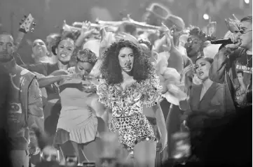  ??  ?? Cardi B (above centre) and Swift (left) perform onstage during the 2018 American Music Awards at Microsoft Theater on Tuesday in Los Angeles, California. — AFP/Reuters photos