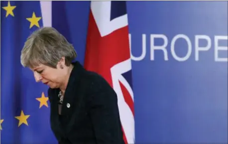  ?? FRANK AUGSTEIN — THE ASSOCIATED PRESS ?? British Prime Minister Theresa May leaves after addressing a media conference at an EU summit in Brussels, Friday. Worn down by three years of indecision in London, EU leaders on Thursday were grudgingly leaning toward giving the U.K. more time to ease itself out of the bloc.