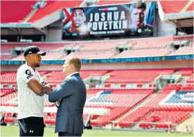  ??  ?? Face to face: Anthony Joshua and Alexander Povetkin at Wembley yesterday