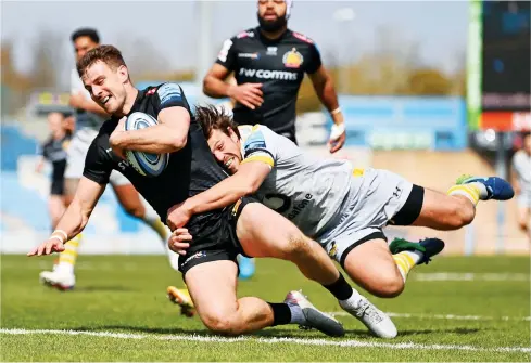  ?? PICTURES: Getty Images ?? Star turn: Ollie Devoto beats the tackle of Rob Miller to score Exeter’s first try