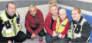  ??  ?? Iestyn with his family and police officers in the custody suite