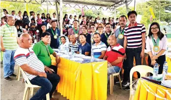  ??  ?? WAITING. The local education officials and staff before the turnover program started.