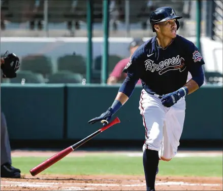  ?? CURTIS COMPTON/CURTIS.COMPTON@AJC.COM ?? Infielder Ehire Adrianza has hit .412 with two homers and 12 RBIs in 34 spring at-bats. The Braves will see if his offensive surge carries into the regular season, but he’ll at least provide defense and versatilit­y.