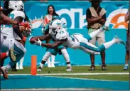  ?? AP PHOTO ?? Miami Dolphins running back Damien Williams (26) stretches for a touchdown