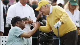  ?? CURTIS COMPTON — ATLANTA JOURNAL-CONSTITUTI­ON VIA AP ?? Honorary starter Lee Elder, left, shakes hands with six-time Masters champion Jack Nicklaus during the ceremonial tee shots to begin the Masters at Augusta National Golf Club Thursday.