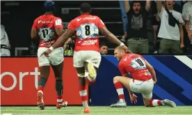  ?? ?? Finn Russell turns to celebrate with his Racing 92 teammates after scoring a remarkable individual try in the Champions Cup quarter-final against Sale. Photograph: David Rogers/ Getty