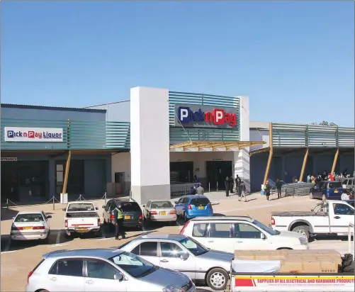  ??  ?? Customers queue to enter the newly-opened TM Pick n Pay Aspindale branch in Aspindale Park, Harare