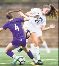  ?? Matthew Brown / Hearst Connecticu­t Media ?? Wilton’s Shelby Dejana, right, battles for the ball with Westhill’s Rachel Weiner in Thursday’s game in Stamford. The Vikings and Warriors played to a 0-0 tie.