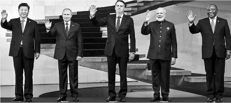  ??  ?? Prime Minister Narendra Modi (second from right) with, from left to right, Chinese President Xi Jinping, Russian President Vladimir Putin, Brazilian President Jair Bolsonaro and South African President Cyril Ramaphosa at the 11th BRICS emerging economies summit in Brasilia, Brazil