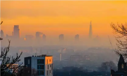  ??  ?? An orange sky over the City of London. Levels of air pollution in London have fallen in recent years. Photograph: Michael Heath/Alamy