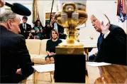  ?? BRENDAN SMIALOWSKI / GETTY IMAGES ?? The top Democratic leaders, Sen. Charles Schumer (left) and Rep. Nancy Pelosi, listen to President Donald Trump at the White House.