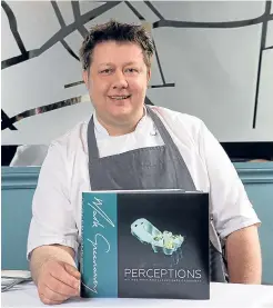  ?? Picture: Paul Johnston. ?? Mark with his new book, Perception­s, Recipes from Mark Greenaway.