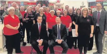  ??  ?? On song Tom Greatrex MP and James Kelly MSP, with the Rutherglen and Cambuslang Rock ‘n’ Pop Chorus