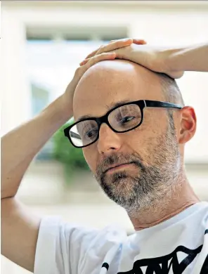  ??  ?? Older and wiser: Moby does not spare himself as he looks back on his past. Right, on stage in Los Angeles in 2016. Below, with musical collaborat­or Julie Mintz
