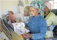  ?? Picture: ROGAN WARD ?? REASONS TO READ: Training of Nal’ibali Story Powered Schools in rural KwaZulu-Natal where parents are encouraged to get to know the books available in their children’s schools