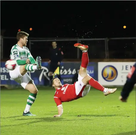  ??  ?? MIkey Drennan scores with a sensationa­l overhead kick. Pic: Carl Brennan.