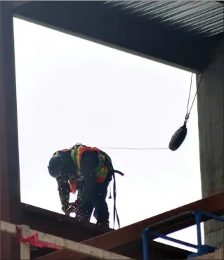  ?? JOE FRIES/Penticton Herald ?? A welder works Thursday on the upper reaches of the David E. Kampe Tower currently under constructi­on at Penticton Regional Hospital.