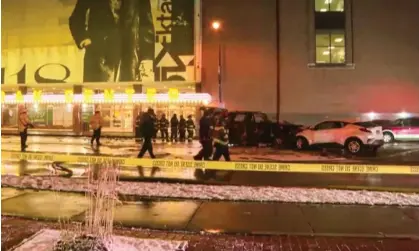  ?? Photograph: WHAM-TV via AP ?? Rochester police investigat­e a fatal fiery crash outside the Kodak Center on 1 January.