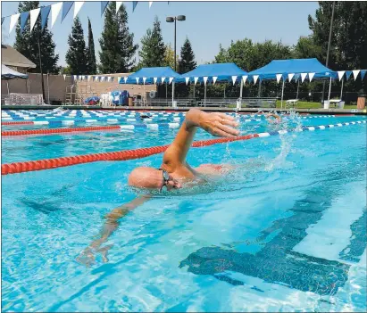  ?? DOUG DURAN — STAFF PHOTOGRAPH­ER ?? Mike Bland, of Livermore, swims laps at the pool at the Robert Livermore Community Center in Livermore on Thursday.