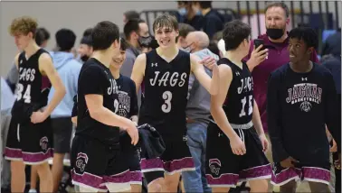  ?? ?? Garnet Valley’s Logan McKee, center, celebratin­g a win over Lincoln in te PIAA Tournament last season, had 11 points and nine rebounds Wednesday night but it wasn’t enough as the Jaguars dropped a 74-58 decision to Parkland in the second round of the PIAA Class 6A playoffs Wednesday. (MedianNew Group file).
