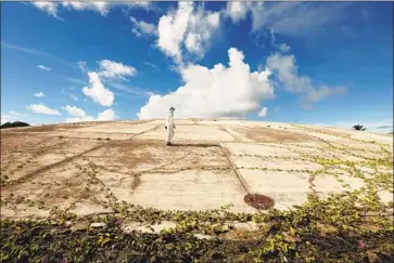  ?? Photograph­s by Carolyn Cole Los Angeles Times ?? THE U.S. entombed nuclear waste from bomb testing in the ’40s and ’50s under concrete on Runit Island.