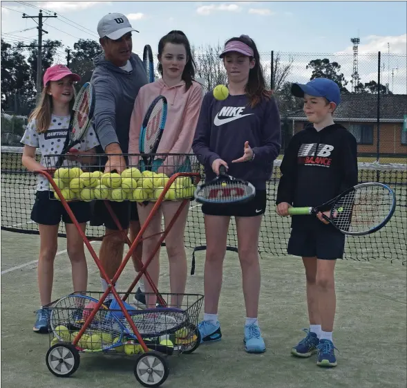  ??  ?? Free tennis: Join Tayla Starling, 10, tennis coach David Starling, Mia Simpson, 12, Miley Morris, 12, Kade Starlung, 10 and the rest of Kyabram Lawn Tennis Club this spring and summer.