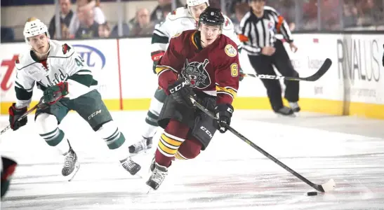  ?? | STEVE WOLTMANN/ WOLVES ?? Vince Dunn is second among AHL rookie defensemen with 34 points ( 11 goals, 23 assists). He also leads the Wolves with 60 penalty minutes.