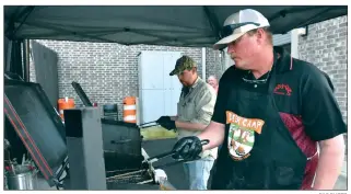  ?? FILE PHOTO ?? Jason Varvil, front, and Wesley Scoggins put another batch of fries and fish into the fryers while volunteeri­ng at last year’s second annual Feed A Senior Fish Fry on March 29 at the Heber Springs Community Center.