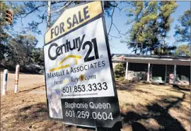  ?? Rogelio V. Solis
Associated Press ?? SOME CREDIT UNIONS help new home buyers with their expenses by refunding portions of real estate agents’ commission­s. Above, a home in Jackson, Miss.