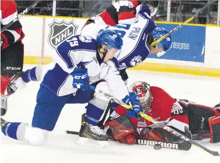  ?? ASHLEY FRASER/POSTMEDIA ?? Ottawa 67’s goalie Olivier Lafreniere makes a save during the Sudbury Wolves’ 7-5 win Sunday at TD Place Arena.