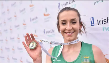  ??  ?? Shona Heaslip of An Riocht A.C. celebrates after winning the Senior Women and U23 8000m during the Irish Life Health Juvenile Even Age Cross Country Championsh­ips 2017 at the National Sports Campus in Abbotstown, Dublin Photo by David...