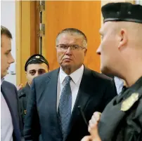  ?? — Reuters ?? Russian Economy Minister Alexei Ulyukayev is escorted upon his arrival for a hearing at the Basmanny district court in Moscow, on Tuesday.