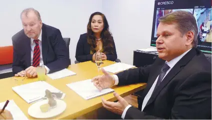  ?? SUNSTAR FOTO / ARNI ACLAO ?? CRESCO.
CEO Michael Waechter (right) takes questions after the opening of their Cebu IT Park office. With him are Willem Smit (left) of CRESCO Legal and CRESCO Shared Services president Maricar Gonzaga.