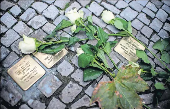  ?? Photo: Johannes Eisele/AFP/Getty Images ?? Humane: Germany’s Stolperste­in (stumbling stone) outside the homes of those murdered by the Nazis make these people real today. South Africa needs its own living memory for the past and the present.