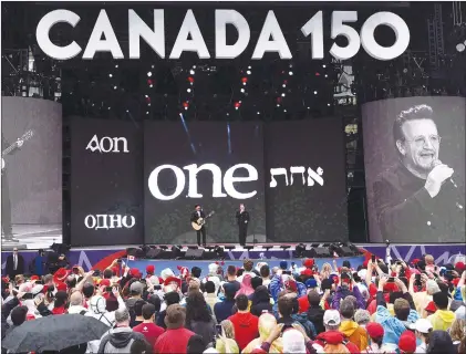  ?? CP PHOTO ?? U2’s Bono, right, and The Edge perform on stage during the Canada Day noon hour show on Parliament Hill in Ottawa on July 1, 2017.